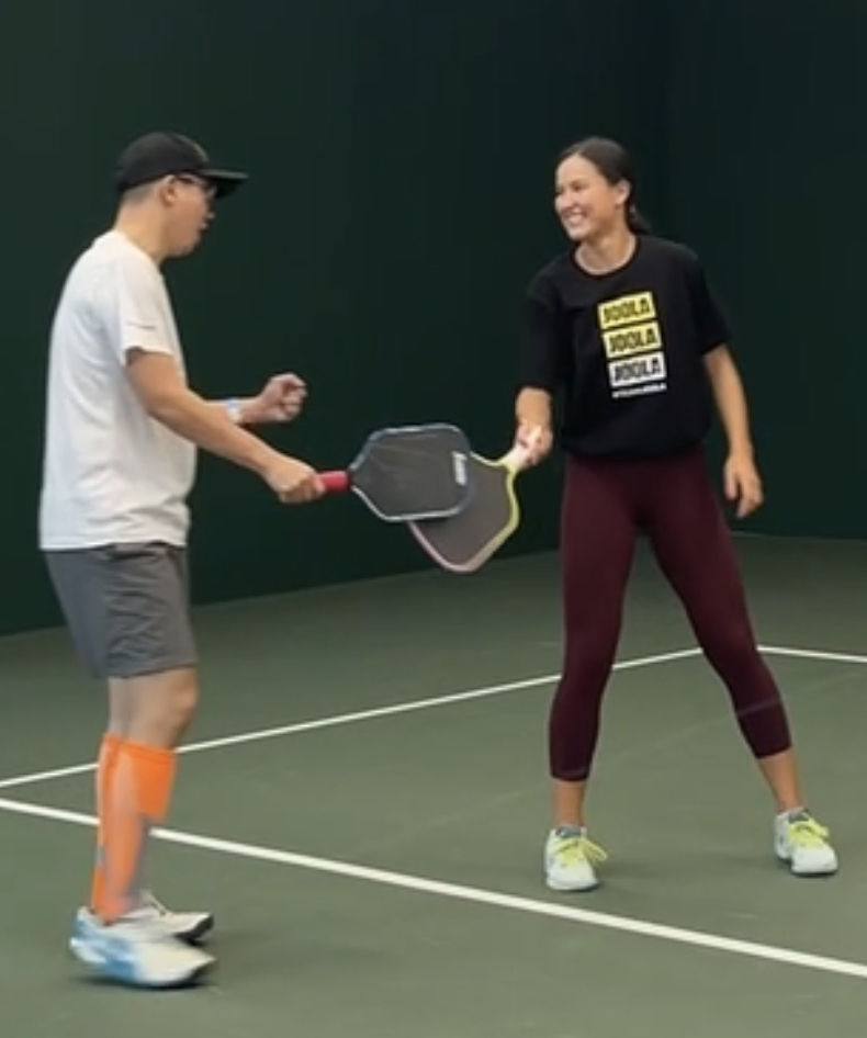 Kid Chan on court celebrating a point with Anna Bright, World Top 5 Professional Pickleball Player.